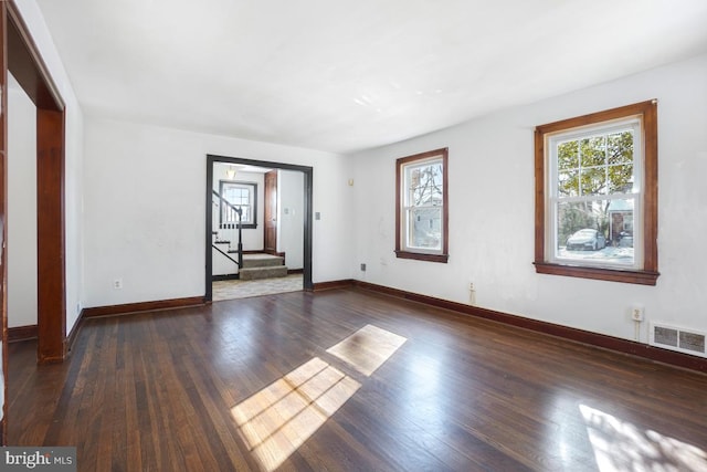 spare room with dark hardwood / wood-style flooring