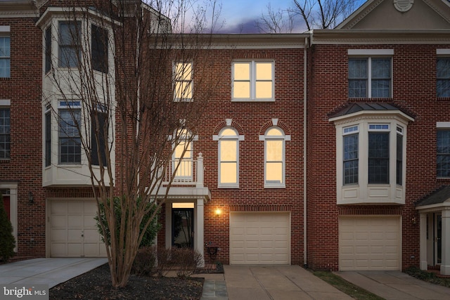 townhome / multi-family property featuring a garage