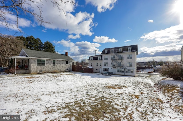 view of snow covered house