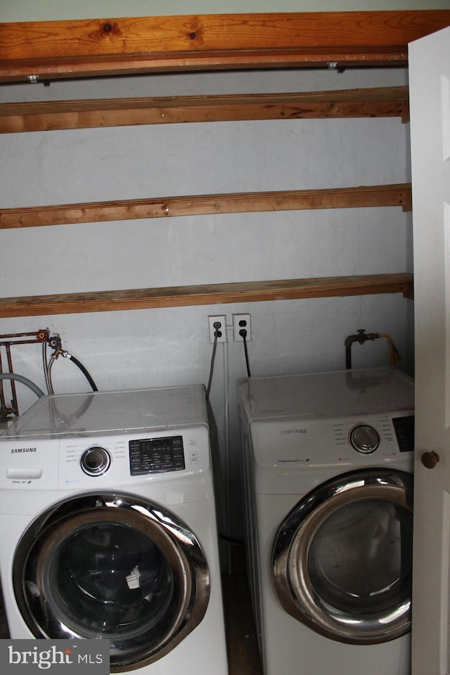 clothes washing area featuring washing machine and clothes dryer