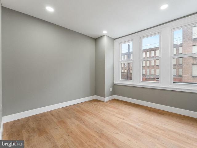 empty room with light hardwood / wood-style floors