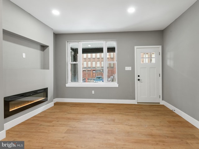 entrance foyer with light wood-type flooring