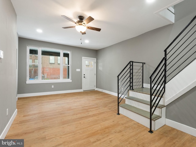 entrance foyer with ceiling fan and light wood-type flooring