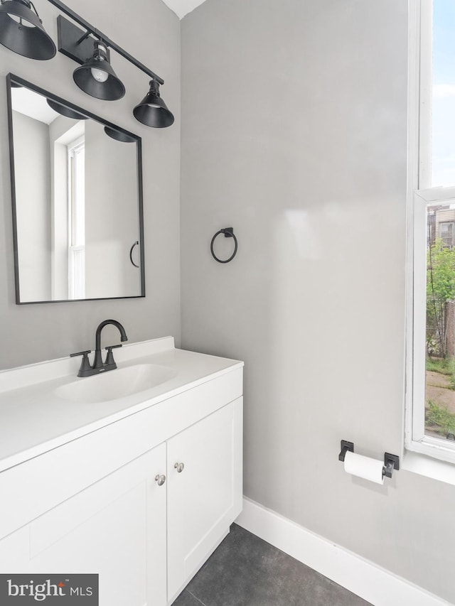 bathroom featuring a healthy amount of sunlight and vanity