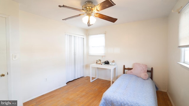 bedroom with ceiling fan and light hardwood / wood-style flooring