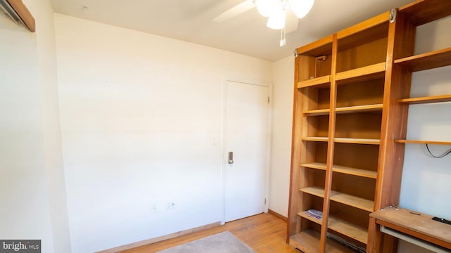 interior space featuring ceiling fan