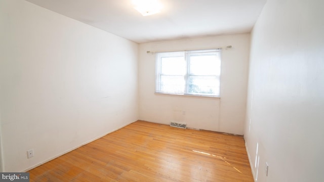 empty room with light wood-type flooring