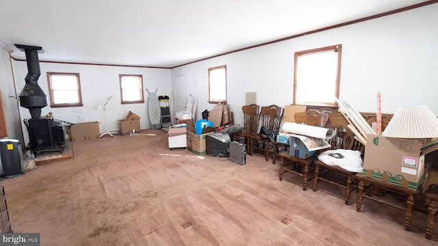 carpeted living room featuring crown molding