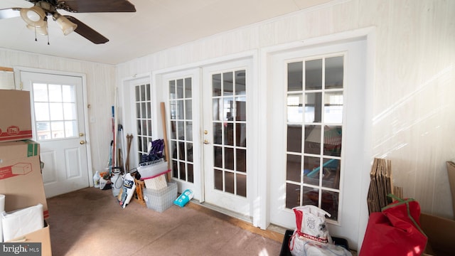 doorway to outside featuring french doors and ceiling fan