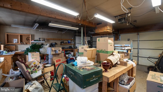 garage featuring a garage door opener and a workshop area