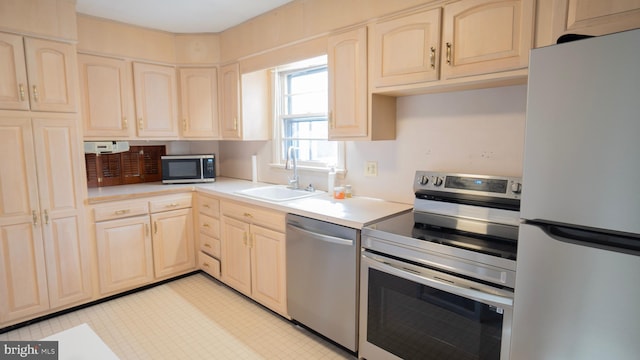 kitchen with appliances with stainless steel finishes and sink