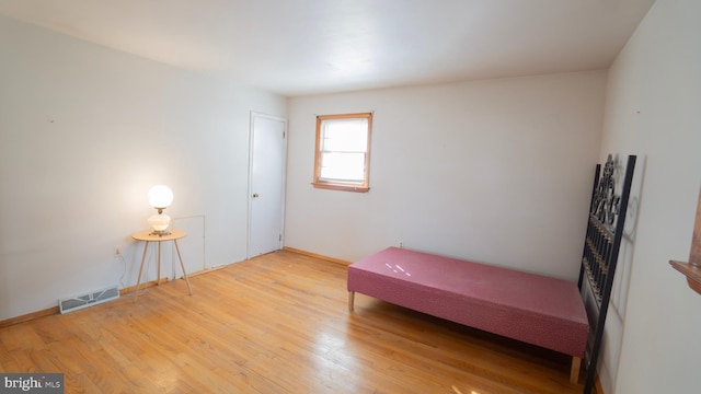 bedroom with light wood-type flooring