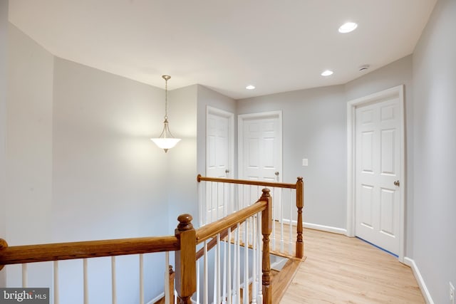 hall with light hardwood / wood-style floors