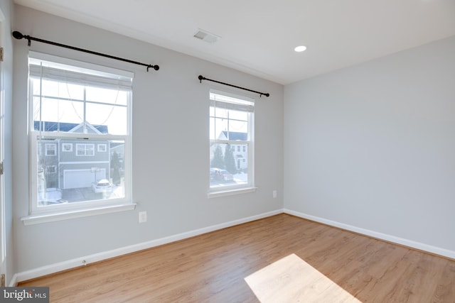 empty room with light wood-type flooring