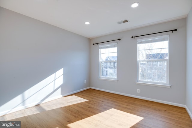 spare room with light hardwood / wood-style floors