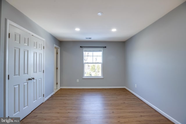 unfurnished bedroom featuring light hardwood / wood-style floors