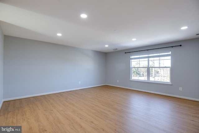 unfurnished room with light hardwood / wood-style floors