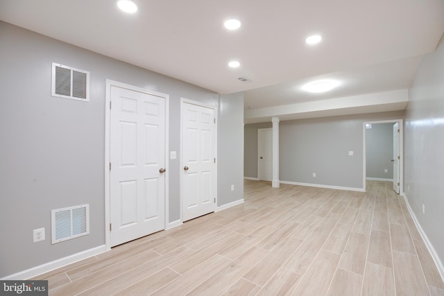 basement featuring light wood-type flooring