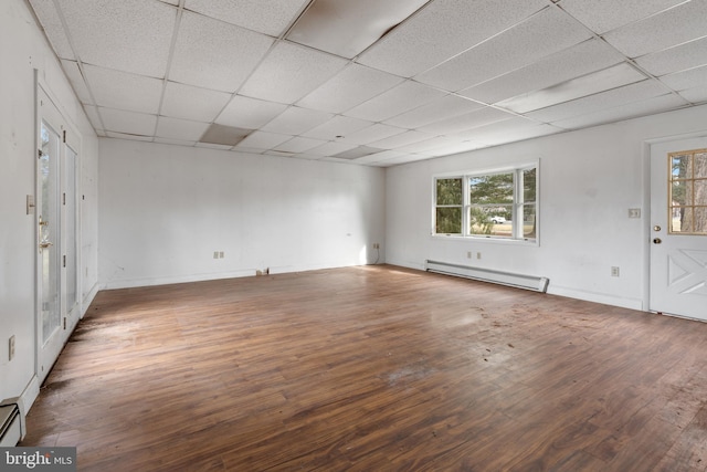 entrance foyer with a baseboard radiator, hardwood / wood-style flooring, and a paneled ceiling