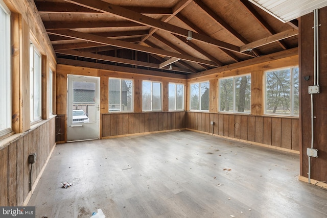 unfurnished sunroom with wood ceiling and vaulted ceiling with beams