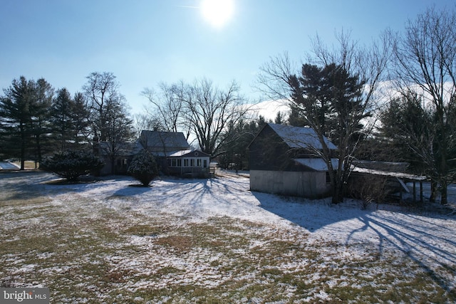 view of yard layered in snow