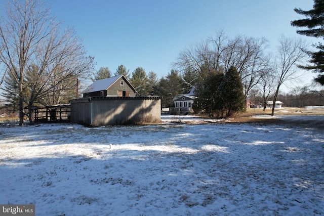 view of yard layered in snow