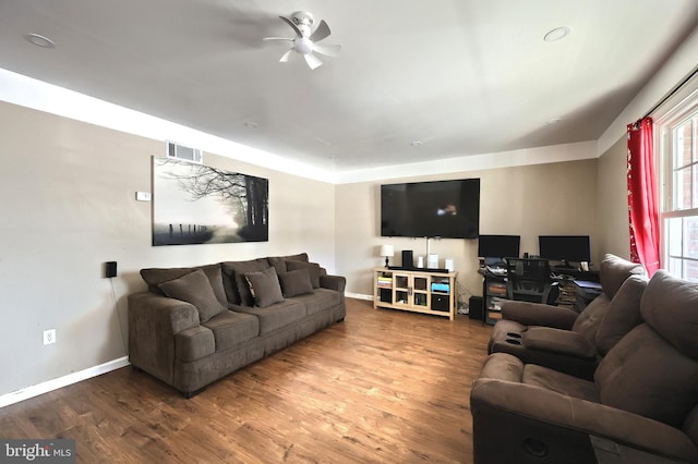 living room with ceiling fan and hardwood / wood-style floors