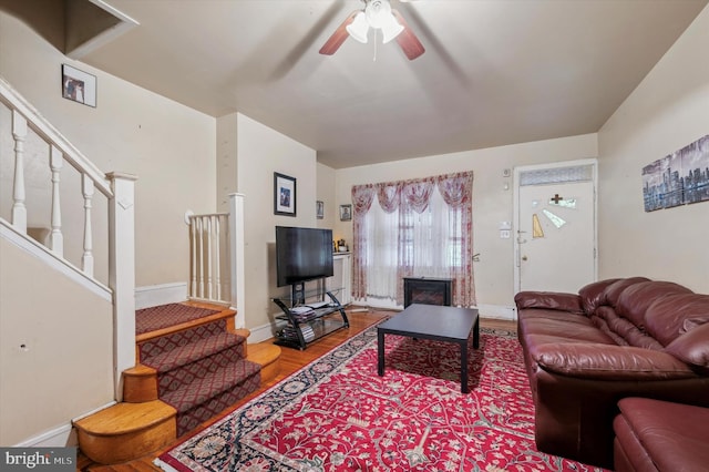 living room featuring ceiling fan and hardwood / wood-style floors