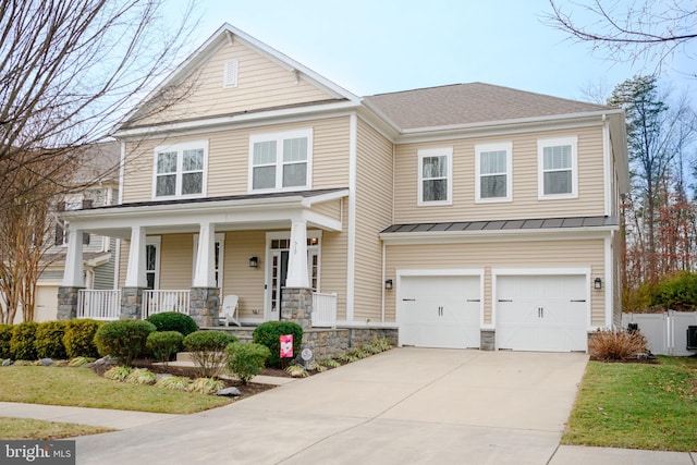 view of front facade featuring a garage and covered porch