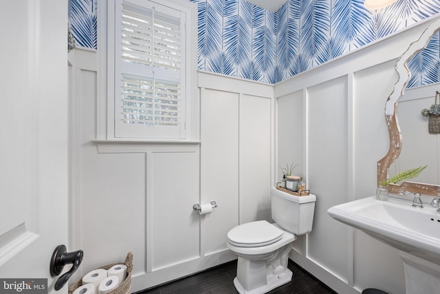 bathroom featuring sink and toilet