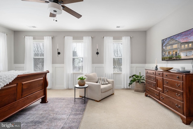 bedroom with ceiling fan and light colored carpet