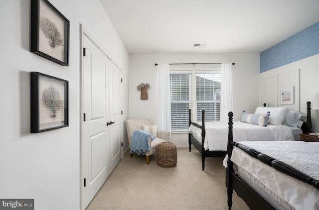 bedroom with light carpet