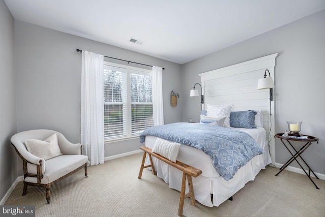 bedroom featuring light carpet