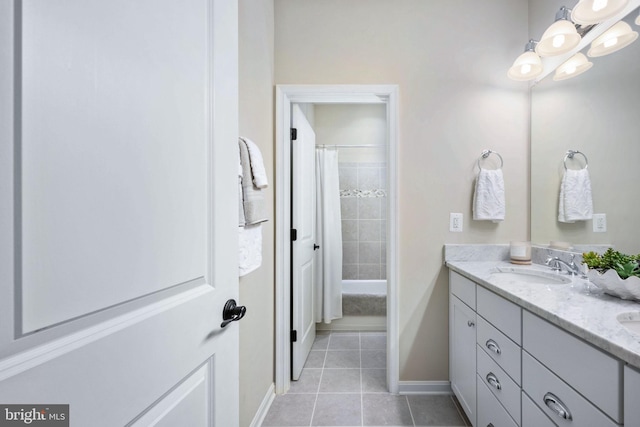 bathroom featuring vanity, shower / bathtub combination with curtain, and tile patterned floors