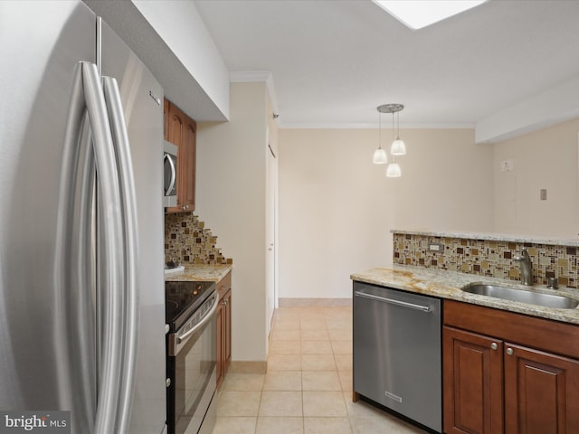 kitchen with appliances with stainless steel finishes, decorative light fixtures, sink, light tile patterned floors, and crown molding