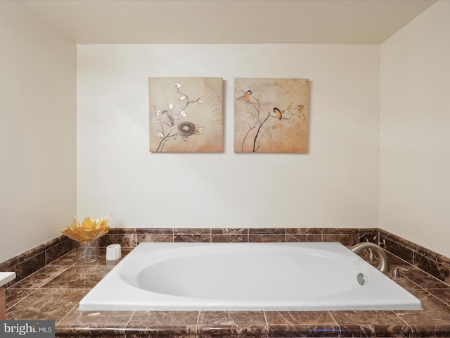 bathroom featuring a relaxing tiled tub