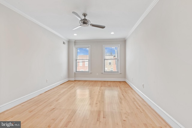 spare room featuring ceiling fan, crown molding, and light hardwood / wood-style floors