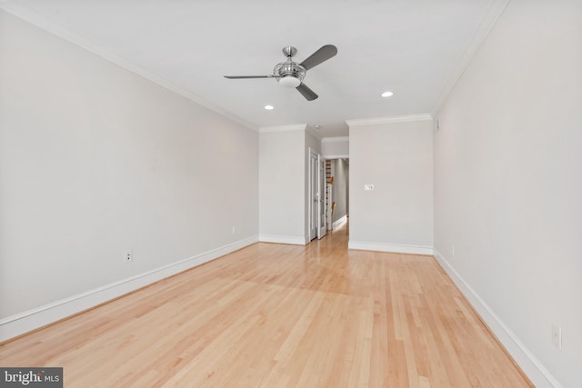 spare room with crown molding, light wood-type flooring, and ceiling fan