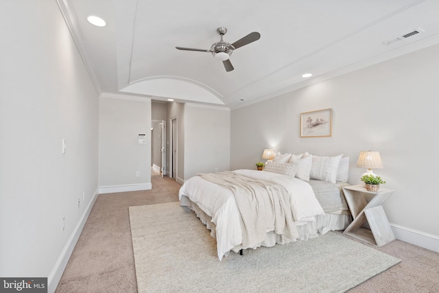 carpeted bedroom featuring ceiling fan, lofted ceiling, and crown molding