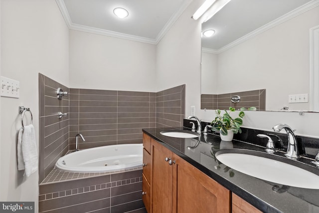 bathroom with vanity, crown molding, and tiled bath