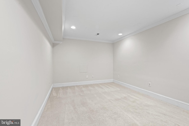 carpeted empty room with crown molding