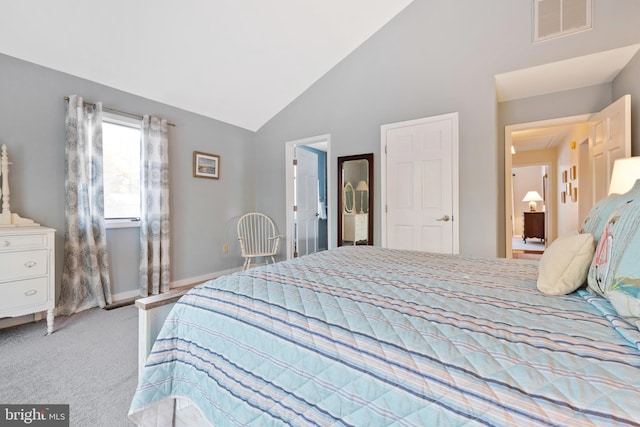 carpeted bedroom featuring high vaulted ceiling