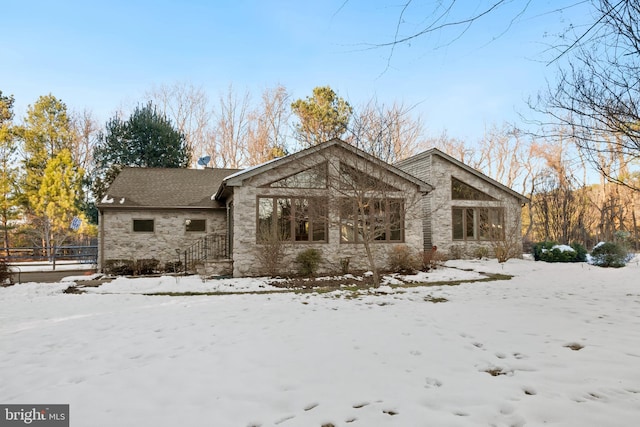 view of snow covered house