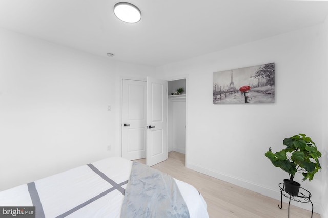 bedroom with light wood-type flooring