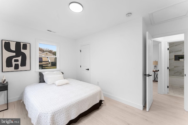 bedroom featuring light hardwood / wood-style floors