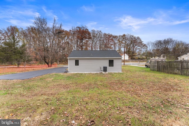 rear view of property with a yard