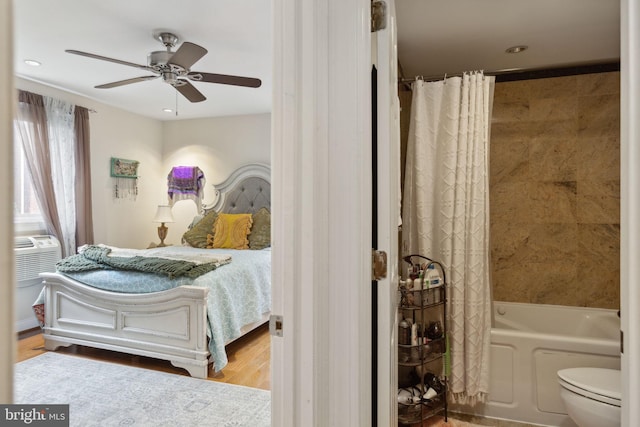 bedroom with light hardwood / wood-style floors and ceiling fan