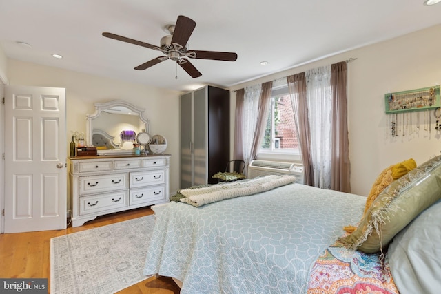 bedroom with light wood-type flooring and ceiling fan