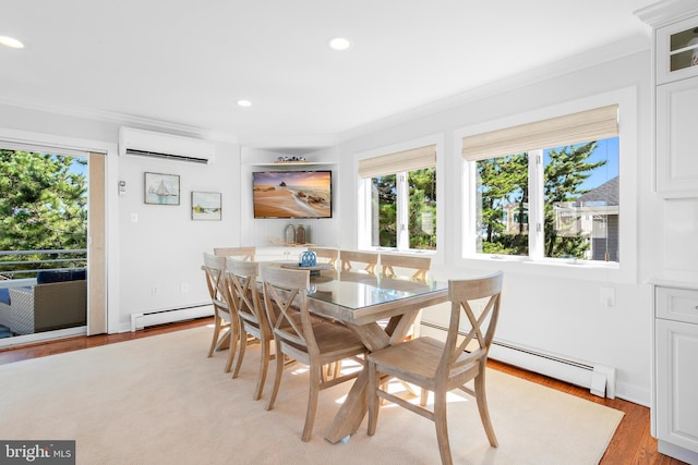 dining area featuring a baseboard heating unit, an AC wall unit, crown molding, and light wood-type flooring