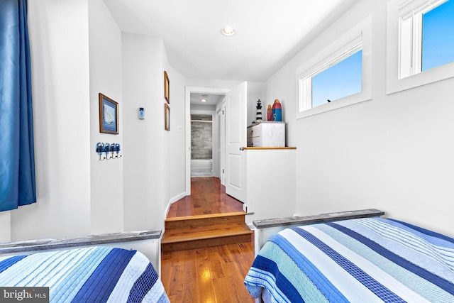 bedroom with dark wood-type flooring